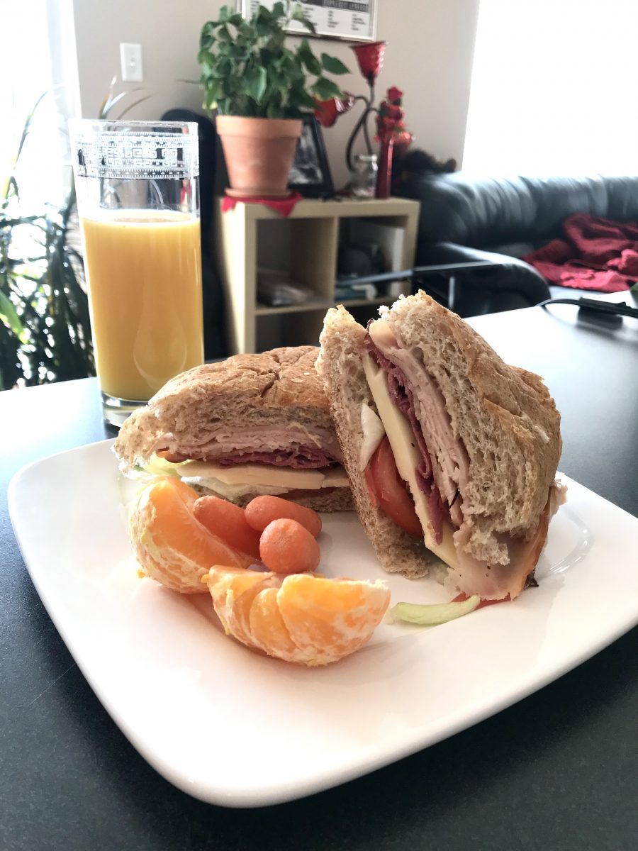 Turkey and Pastrami sandwich on a bolillo roll.
