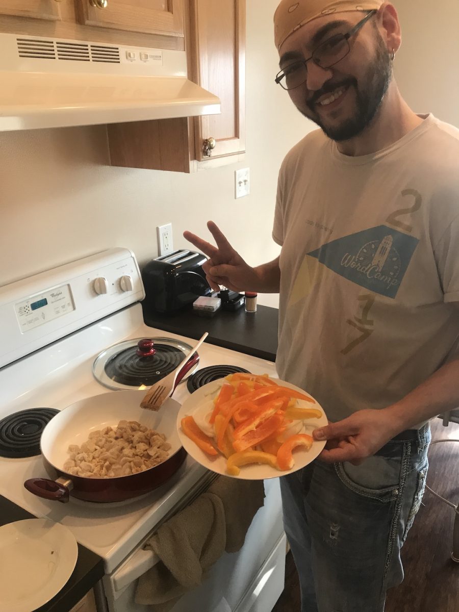Chilla adding peppers and onions.