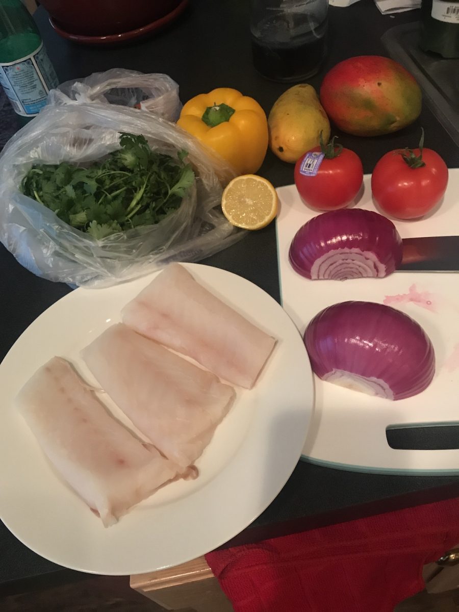 Ingredients for mango salsa baked cod include red onion, tomato, mango, cilantro and peppers.