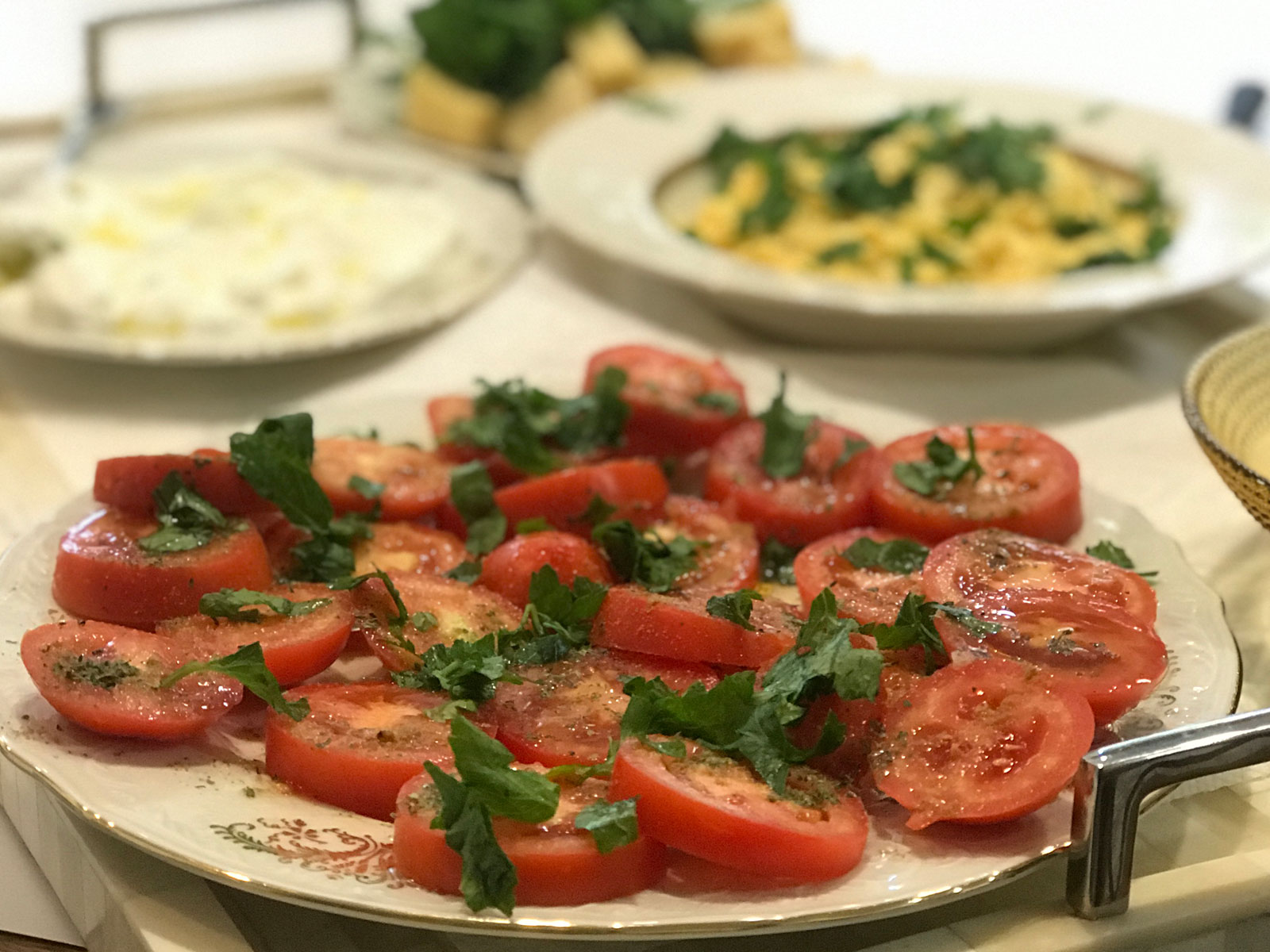 A new traditional breakfast with scrambled eggs, tomatoes, and cheese.